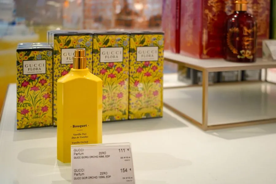 Gucci flora perfumes on a counter.